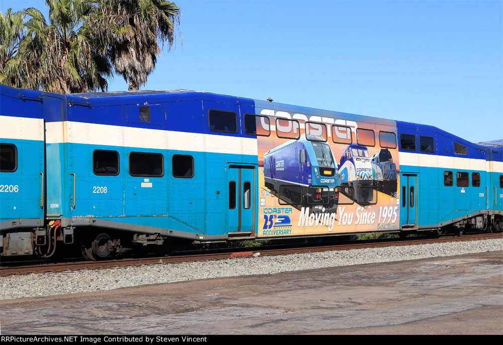 San Diego "Coaster" coach #2208 with ad wrap showing locos.